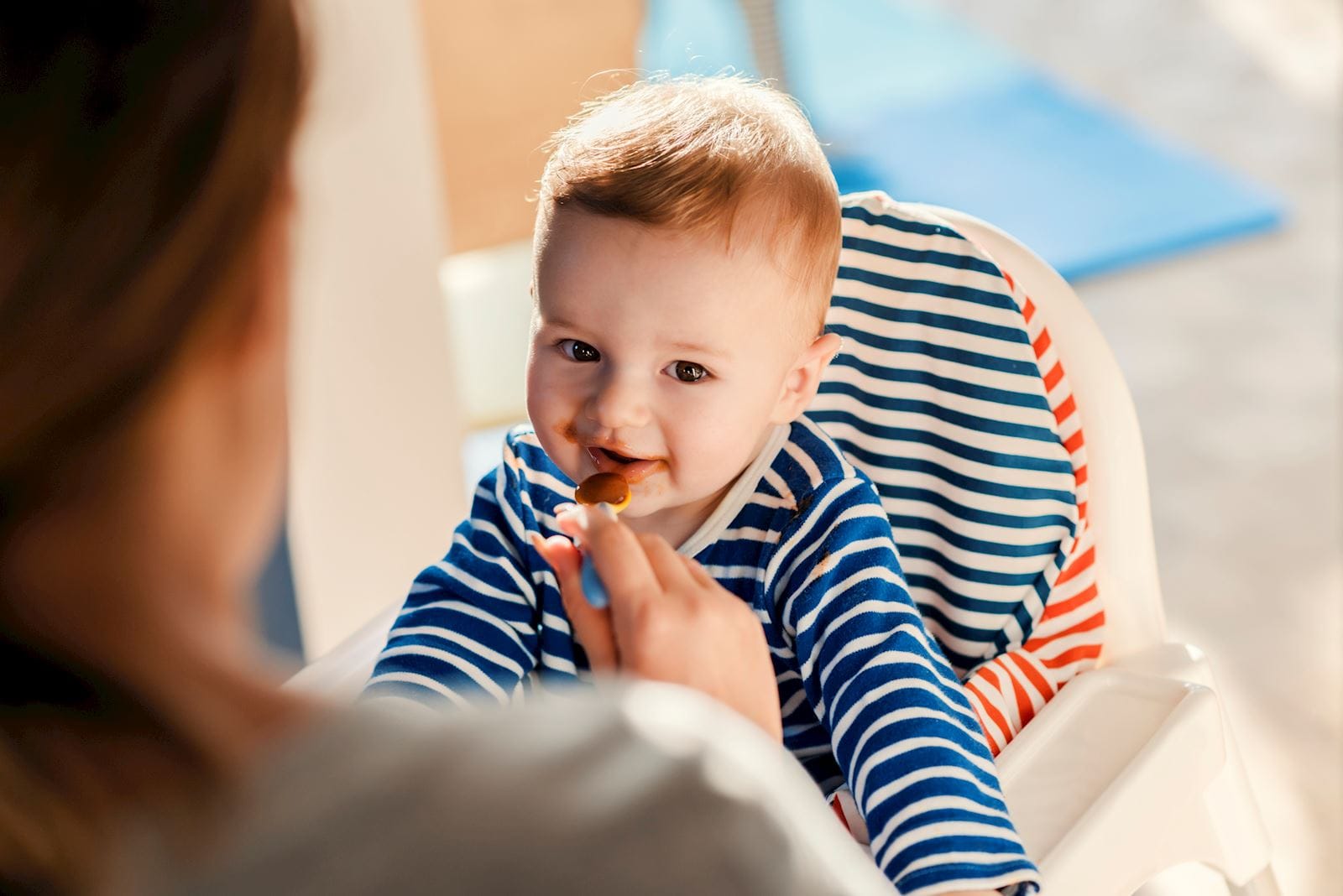 Baby eating food from a spoon