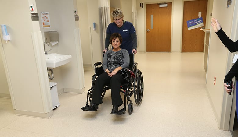 Endoscopy Center - nurse wheeling patient out after procedure is complete and patient is cleared to go home