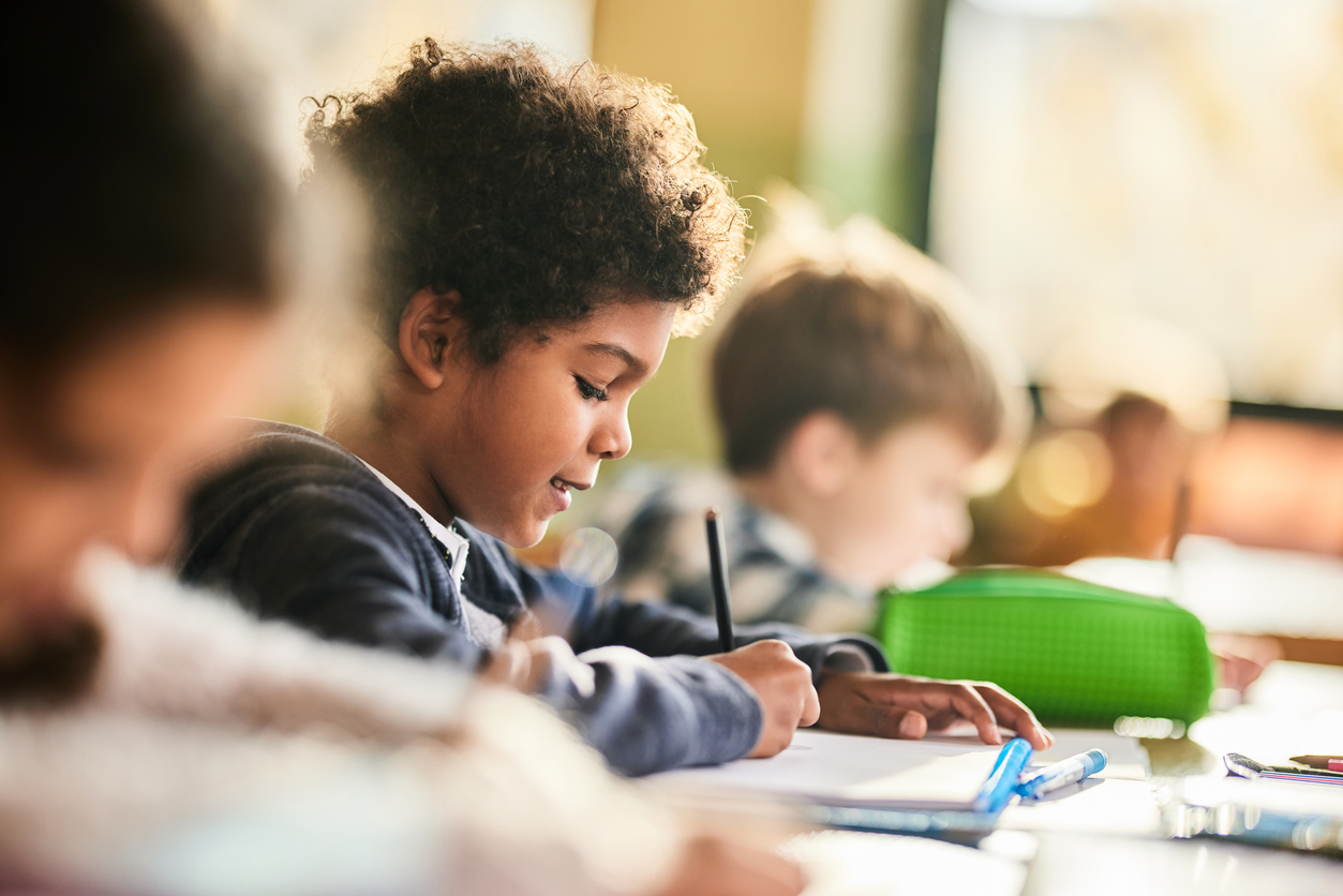 child working on homework at school