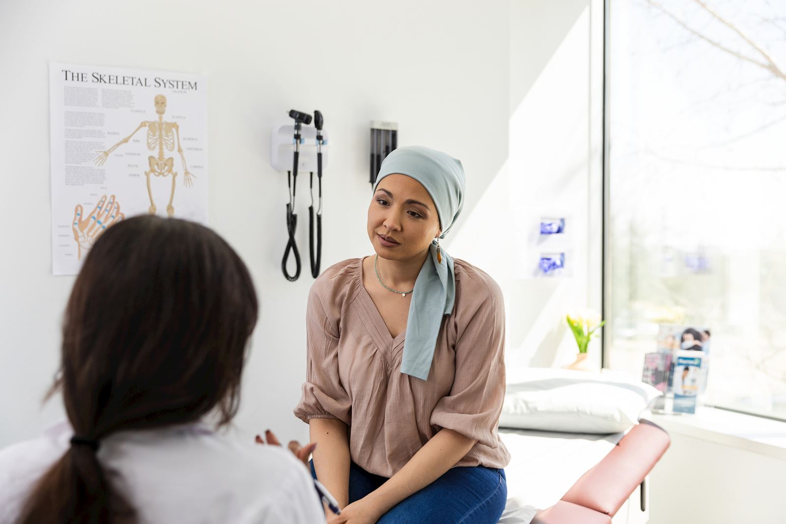 female cancer patient talking with doctor