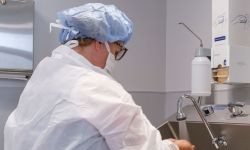 Doctor scrubbing in for surgery
