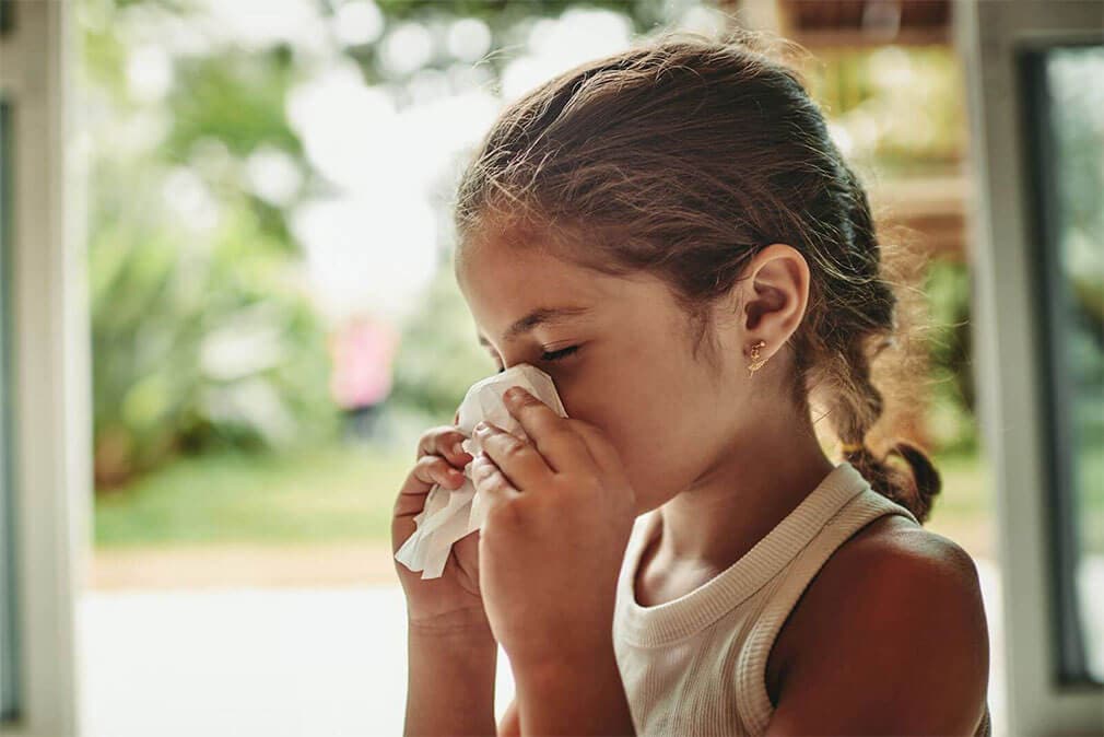 Young girl suffering from allergies