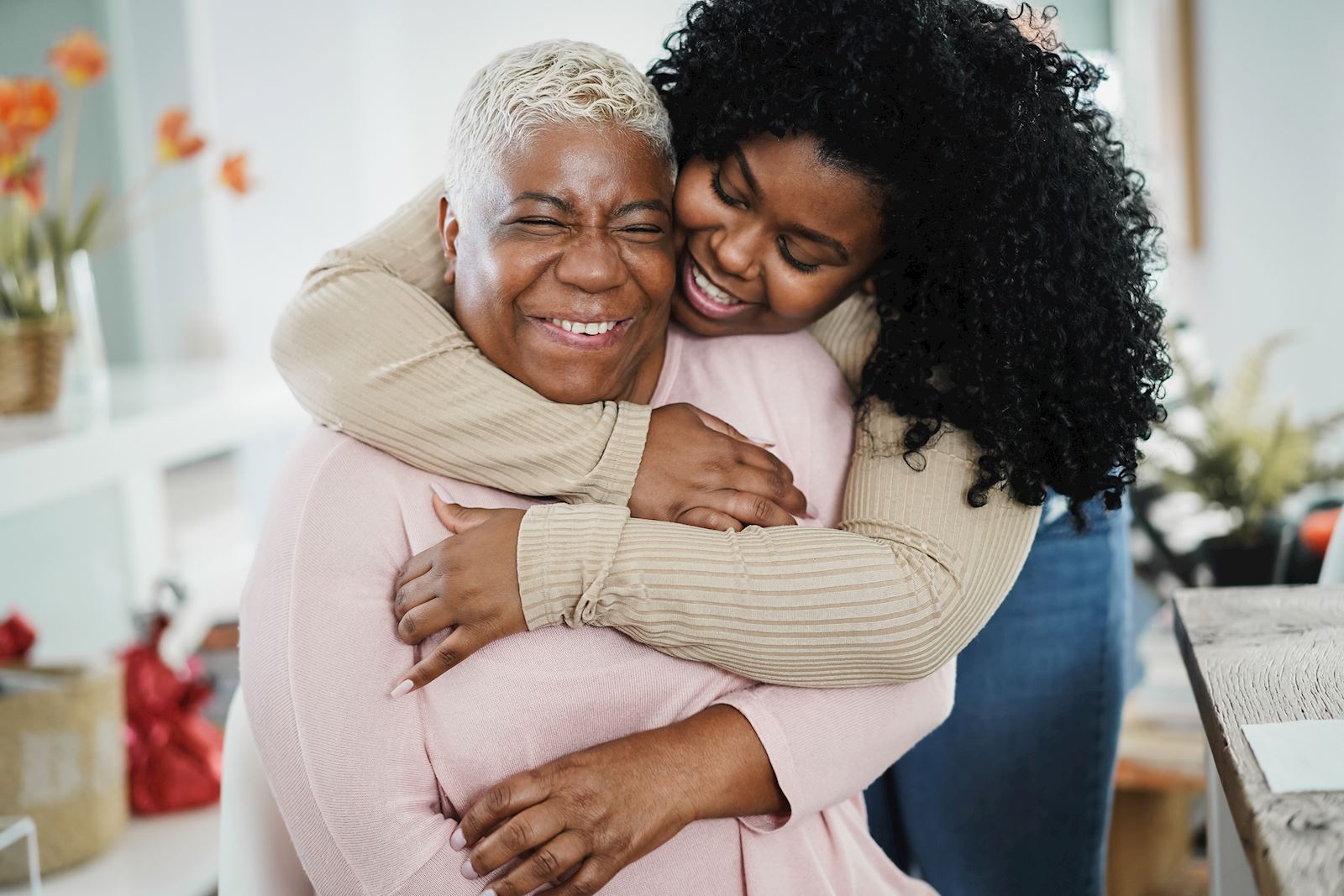 Woman embracing her grandmother 