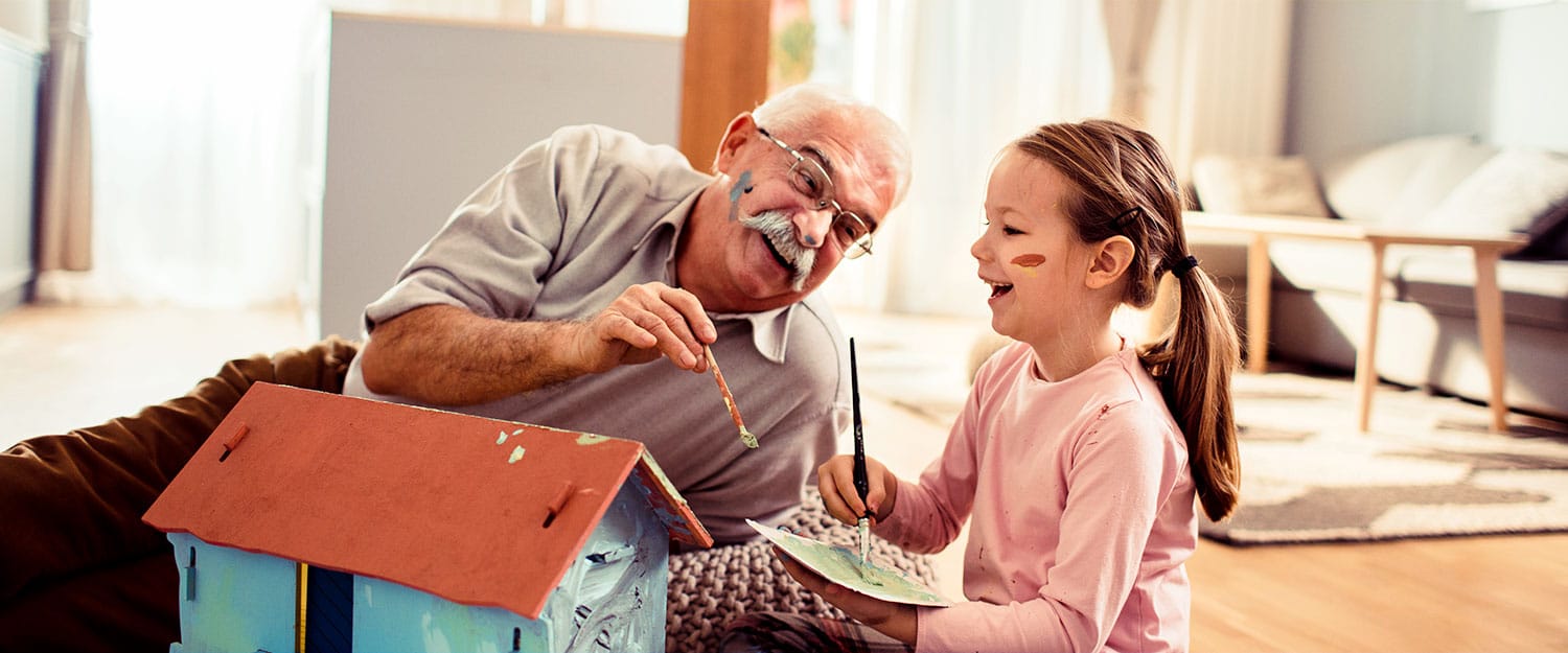 Grandpa with granddaughter painting