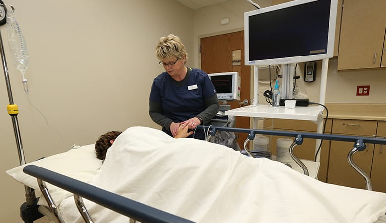 Endoscopy Center - patient with nurse prepping for procedure